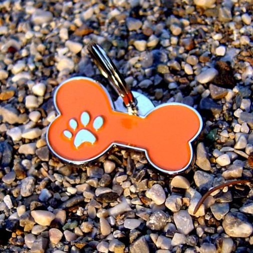 Custom personalized dog name tag Bone mjavhov orange

This unique, cute and quality dog id tag is offered with laser engraved name and phone no. or your custom text. Stainless steel split ring for easy attachment to your pets collar. All items are also available as keychains.
Gift for dogs and dog lovers.

Color: colored/silver
Size: 34 x 21 mm

Engraving area: 27 x 7 mm
Laser engraving personalization on the back side is included in the price. Enter the text you wish to have engraved. Suggestion: dog's name and phone number. We engrave on the back side of the tag. Engraving will be centered and easy to read. If you go over the recommended count then the text becomes smaller, and harder to read.

Metal, chrome plated dog tag or key ring. 
Hand made, hand colored, made in Slovenia. 

In stock.
