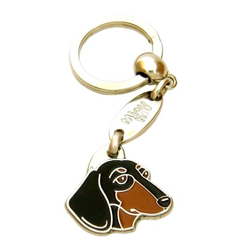 Custom personalized dog name tag Dachshund black and tan

This unique, cute and quality dog id tag is offered with laser engraved name and phone no. or your custom text. Stainless steel split ring for easy attachment to your pets collar. All items are also available as keychains.
Gift for dogs and dog lovers.

Color: colored/silver
Size: 29 x 28 mm

Engraving area: 17 x 12 mm
Laser engraving personalization on the back side is included in the price. Enter the text you wish to have engraved. Suggestion: dog's name and phone number. We engrave on the back side of the tag. Engraving will be centered and easy to read. If you go over the recommended count then the text becomes smaller, and harder to read.

Metal, chrome plated dog tag or key ring. 
Hand made, hand colored, made in Slovenia. 

In stock.
